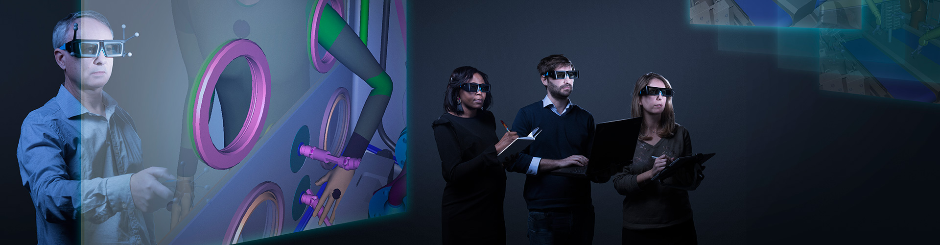 Men and women using augmented reality in order to manipulate, observe and analyze engineering projects.